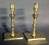 A Pair of Early Bold Saucer Base Candlesticks